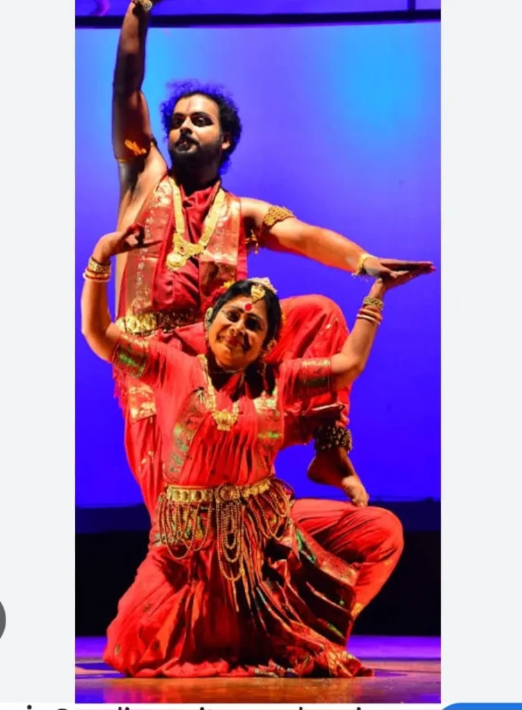 a man and woman dancing on a stage